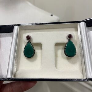 Sterling Silver earrings with jacket. Garnet stones